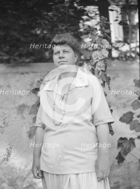 Unidentified woman, possibly Mrs. Cosgrave, standing outdoors, not before 1917. Creator: Arnold Genthe.