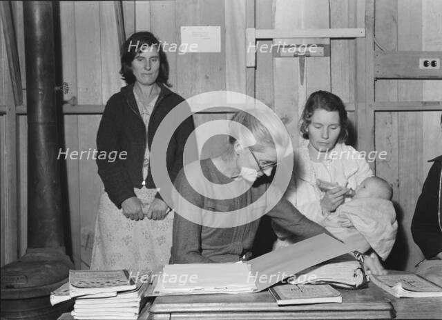 Meeting of the Mothers' Club in Arvin camp for migrant workers, Kern County, 1938. Creator: Dorothea Lange.