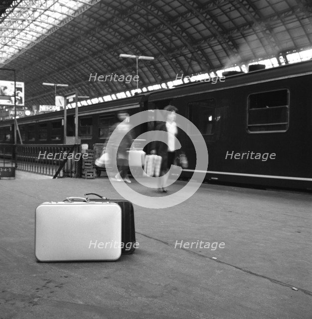 Travellers on a platform, Centraal Station, Amsterdam, Netherlands, 1963. Artist: Michael Walters