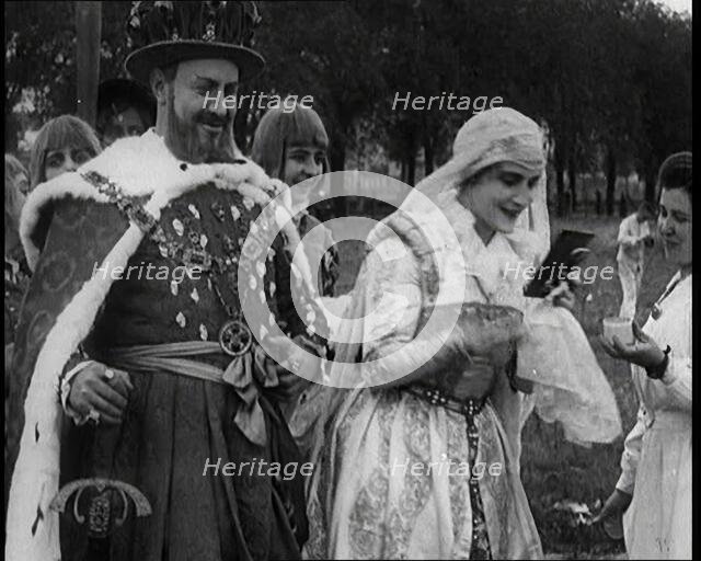 The Actor Henny Porten Dressed in Period Costume Putting on Make up from a Powder Compact..., 1920s. Creator: British Pathe Ltd.