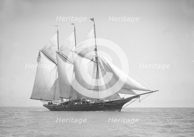 The three-mast auxiliary schooner 'Invincible', 1911. Creator: Kirk & Sons of Cowes.