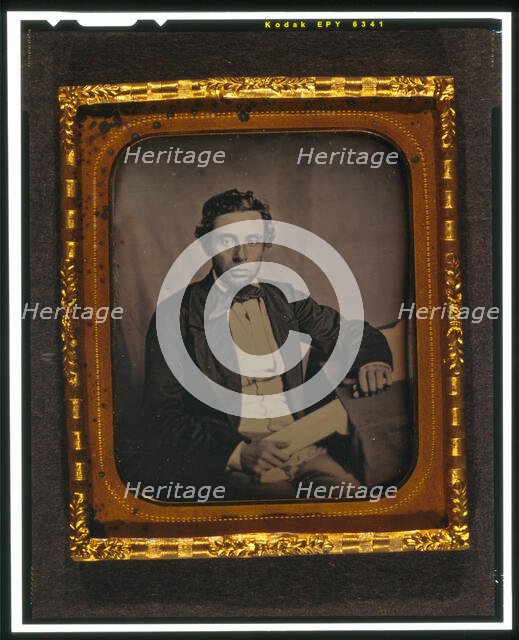 Alfred Francis Russell, three-quarter length portrait, full face, seated..., between 1856 and 1858. Creator: Augustus Washington.