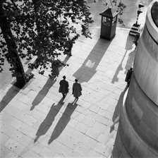Pedestrians on the Victoria Embankment, London, seen from Waterloo Bridge. Artist: SW Rawlings