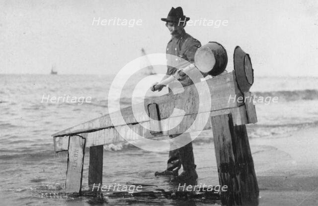 Miner washing gold, between c1900 and c1930. Creator: Unknown.