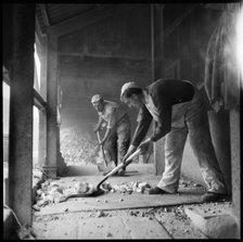 Men shovelling flint in a flint calcinating kiln, WJ Dolby works, Stoke-on-Trent, 1965-1968. Creator: Eileen Deste.