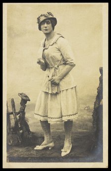 An actor, in drag, performing English theatre at a prisoner of war camp in Cottbus, [1910-1919?]. Creator: Unknown.