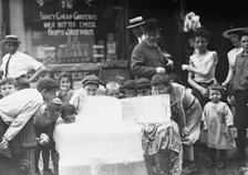 Licking blocks of ice on hot day, between c1910 and c1915. Creator: Bain News Service.