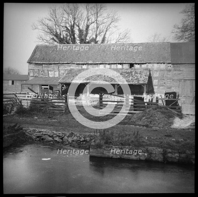 An unidentified timber framed barn with attached cart shed, Herefordshire, 1944. Creator: Marjory L Wight.