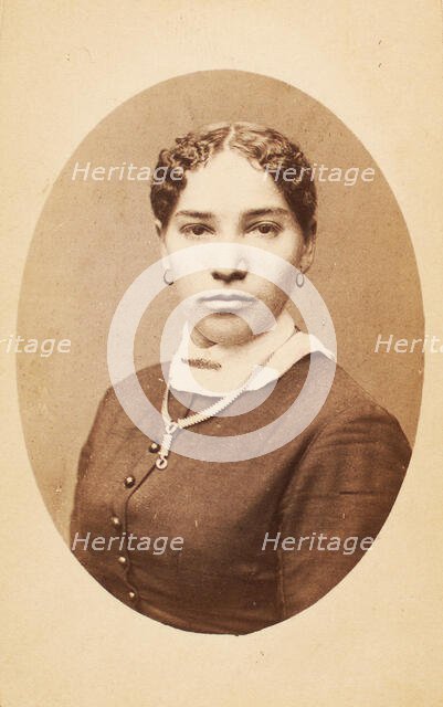 Studio portrait of young woman wearing chain necklace, c1880-c1889. Creator: Unknown.
