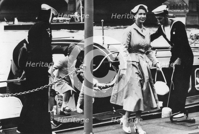 Queen Elizabeth II steps ashore at Westminster Pier from the Royal Barge, 1954.  Creator: Unknown.