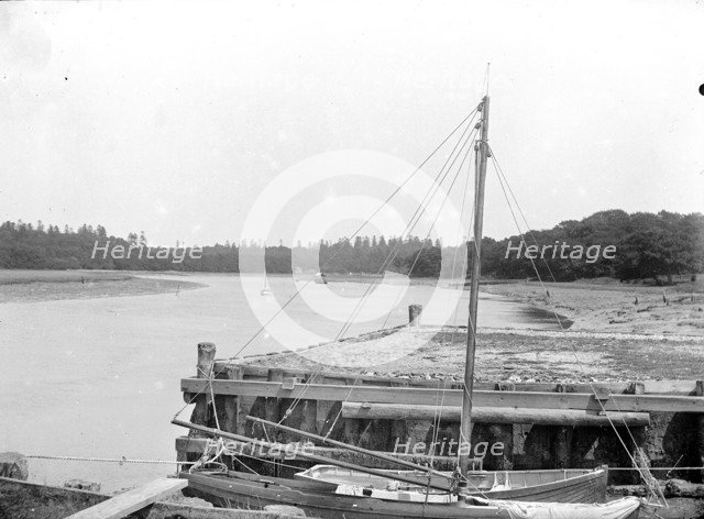 Small boats moored alongside a town jetty, Beaulieu, Hampshire, c1860-c1922. Artist: Henry Taunt