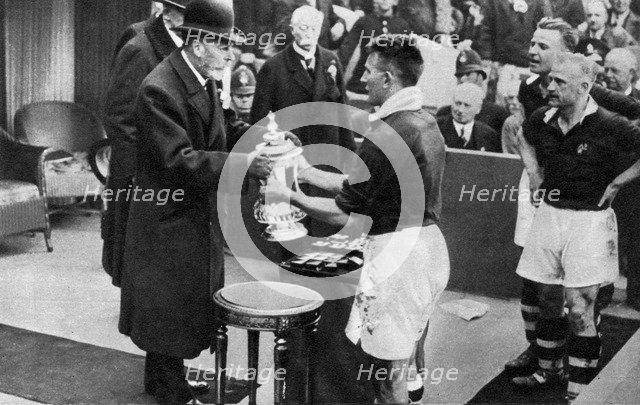 King George V presenting the FA Cup, Wembley Stadium, London, c1923-1936 (1937).Artist: Fox
