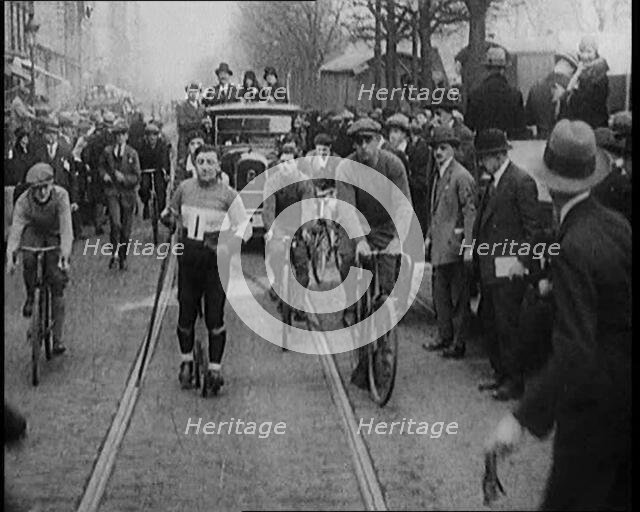 Racers Skiing Through Paris, France on Wheeled Skis, 1929. Creator: British Pathe Ltd.