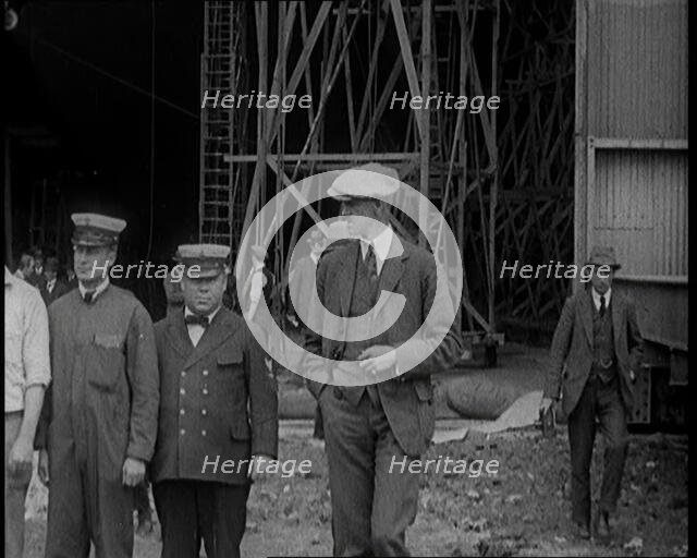 American Airship Crew Members Standing Outside the Hangar of an R 38 Airship in the United..., 1921. Creator: British Pathe Ltd.
