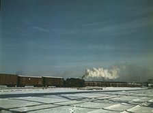 A train pulling out of the freight house at C & NW RR's Proviso(?) yard, Chicago, Ill., 1942. Creator: Jack Delano.