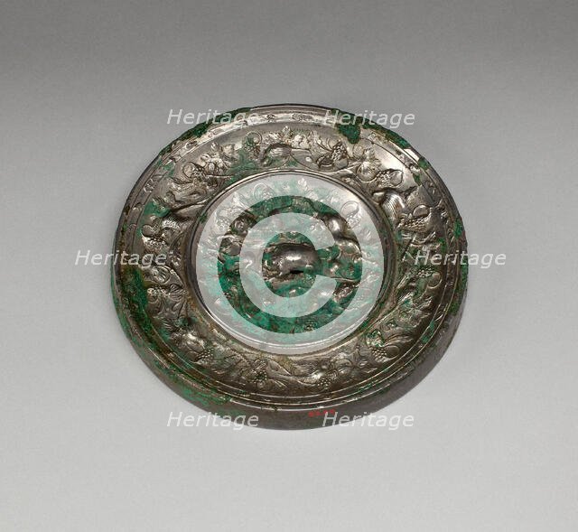 Mirror with "Lion and Grapevine" Design, Tang dynasty (A.D. 618-907), 8th century. Creator: Unknown.