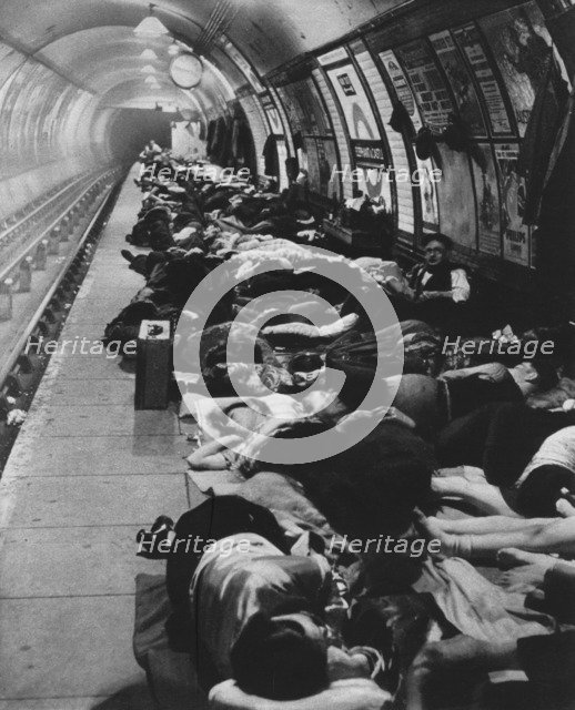 'Those who went to shelters began a new kind of night-life, 11th November, 1940', 1942. Artist: Unknown.