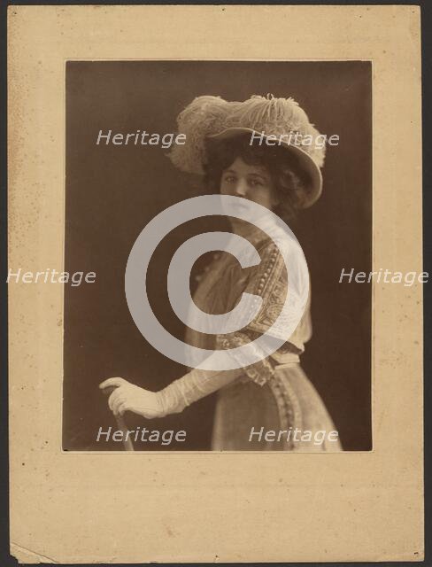Portrait of a Woman Standing with Umbrella, 1907-1943. Creator: Louis Fleckenstein.