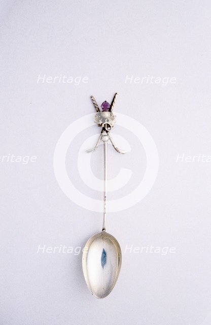 Silver spoon with crossed golf club motif, British, c1920s. Artist: Unknown