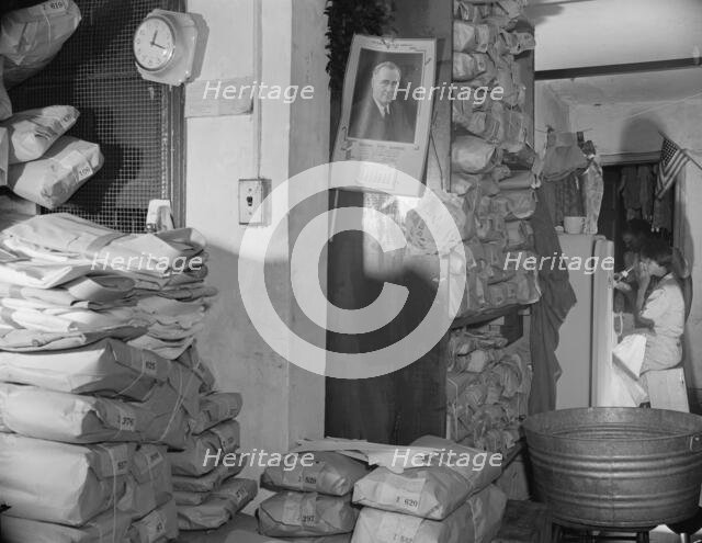 Interior of a Chinese laundry located under the apartment of..., Washington, D.C., 1942. Creator: Gordon Parks.