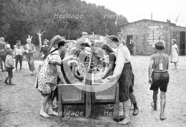 Washing-up at a juvenile summer holiday camp, Germany, 1922.Artist: Otto Haeckel