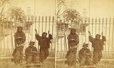 Let brotherly love prevail. [Young chimney sweeps leaning on a fence], (1868-1900?). Creator: Unknown.