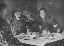 'Red Cross officers at dinner in a dug-out', 1914. Artist: Unknown.