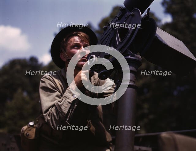 Good man, good gun: a private of the armored forces does some practice..., Fort Knox, Ky., 1942. Creator: Alfred T Palmer.