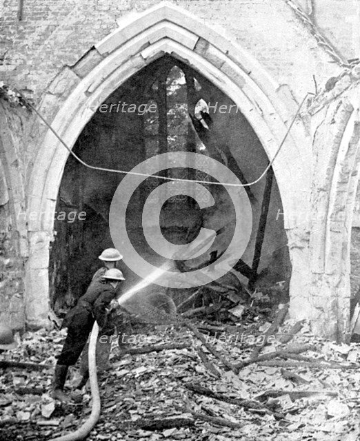 British firefighters damping down a bombed church, World War II, June 1940. Artist: Unknown