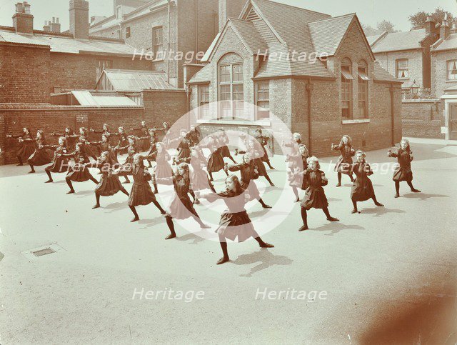 Girls doing drill in the playground, Wilton Road School, London, 1907. Artist: Unknown.