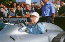 Stirling Moss prepares for the off. Goodwood festival of speed. Artist: Unknown.
