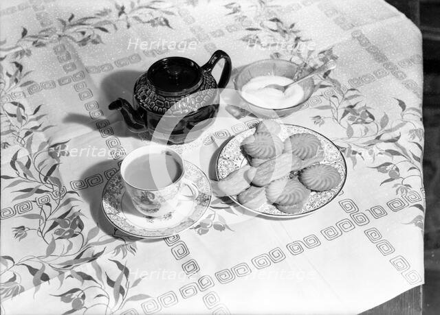 Tea and biscuits, c1955. Creator: Arthur Charles Kirby Ware.