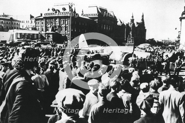 Crowds around a downed German bomber on display in Sverdlov Square, Moscow, 1941. Artist: Unknown