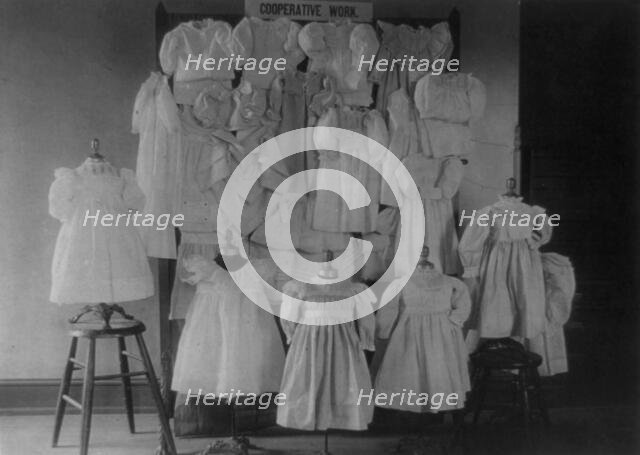 Dresses, possibly made by students in a Washington, D.C. school, on display, (1899?). Creator: Frances Benjamin Johnston.