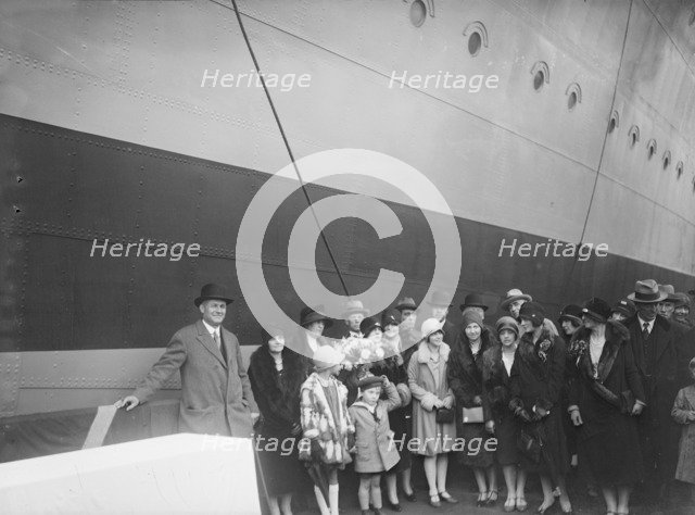 Christening Group possibly at J Samuel White and Co shipyard, Cowes, Isle of Wight, c1930s.  Creator: Kirk & Sons of Cowes.
