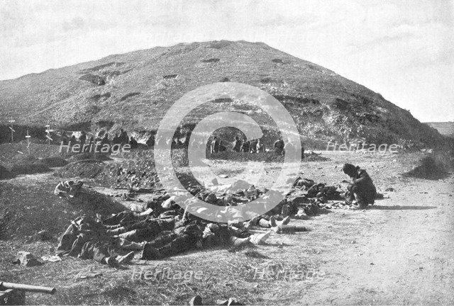 Russian soldiers collecting cartridges from the dead before burial, Russo-Japanese War 1904-5. Artist: Unknown