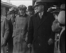 Alphonse Gabriel Capone AKA 'Al Capone' Being Escorted by a Group of Male American Civilians...1930. Creator: British Pathe Ltd.