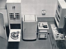 'View of a kitchen, designed by H.M.V. Household Appliances', 1938. Artist: Unknown.