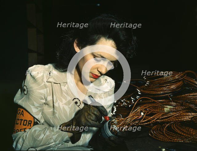 Woman aircraft worker, Vega Aircraft Corporation, Burbank, Calif. , 1942. Creator: David Bransby.