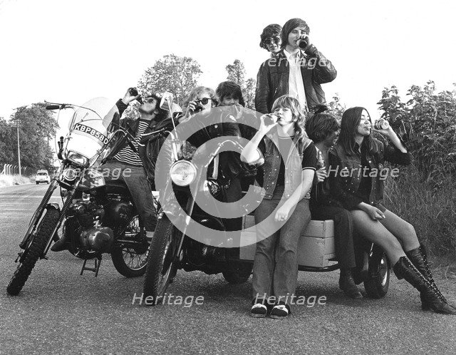 Young people on motorbikes, c1970.