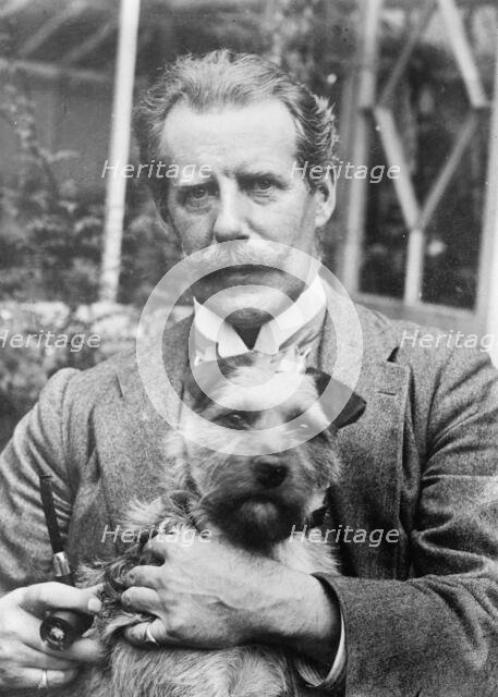 Bernard M. Partridge holding dog, 1910. Creator: Bain News Service.