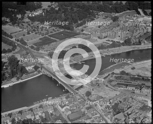 Hampton Court and construction of the new Hampton Court Bridge alongside the old one, c1930s. Creator: Arthur William Hobart.