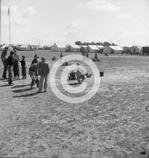 Marble time in FSA migratory labor camp, near Calipatria, Imperial Valley, CA, 1939. Creator: Dorothea Lange.
