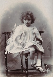 Nora Schuster aged 3, seated, facing forwards, c1895. Creator: Mrs Fred Wilkinson.