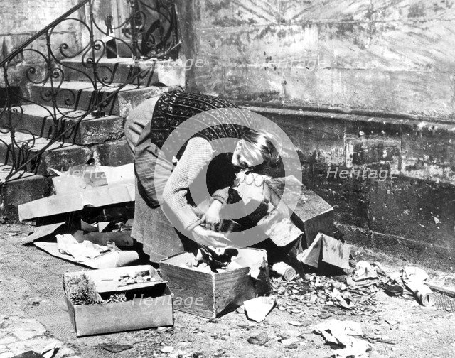 Woman scavenging for food, Bayreuth, Germany, April 1945. Artist: Unknown
