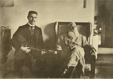 Russian author Leo Tolstoy with the balalaika player Boris Troyanovsky, Russia, 1909. Artist: Sophia Tolstaya