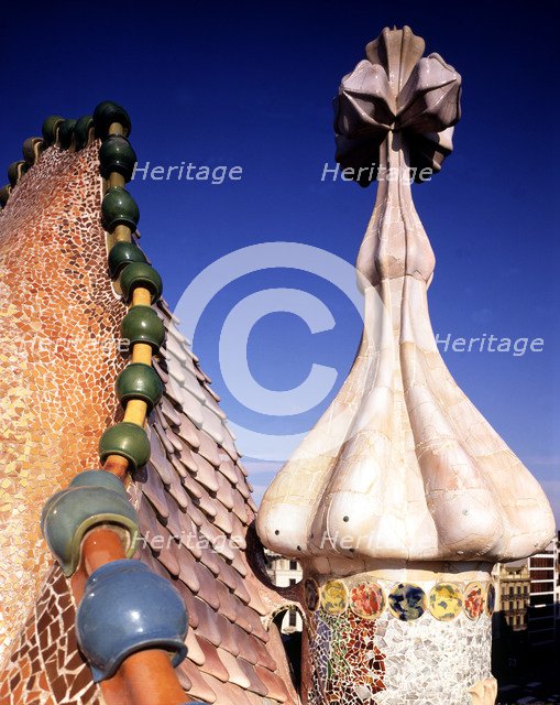 Upper finishing of the façade of Batllo House with a pinnacle finished in a four-armed cross, bui…