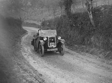 Austin 7 arrow-bodied 2-seater of JS Drewett competing in the NWLMC London-Gloucester Trial, 1931. Artist: Bill Brunell.
