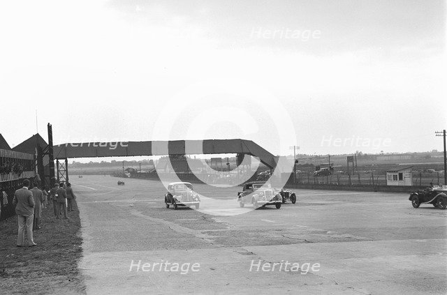 Two Ford V8s and a MG PB at the MCC Members Day, Brooklands, 1938 or 1939. Artist: Bill Brunell.