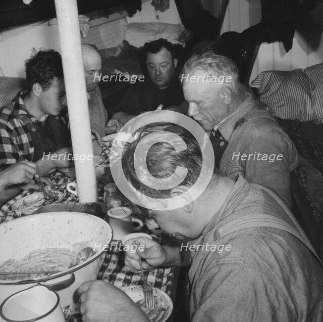On board the fishing boat Alden, out of Gloucester, Massachusetts, 1943. Creator: Gordon Parks.